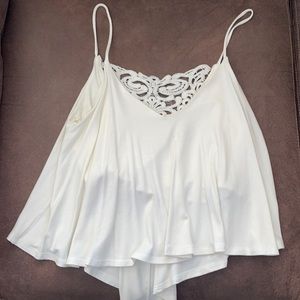 Spaghetti strap cream top with crotchet detailing on the back-size small